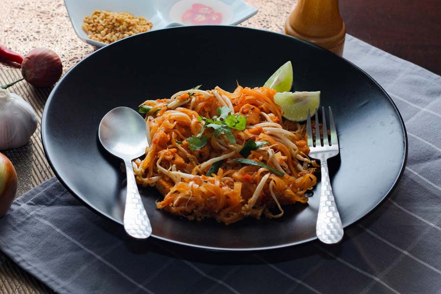 pad thai with fork and spoon