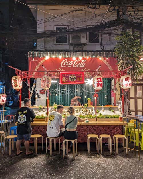 Tourists-Eating-Street-Food-Chinatown-Bangkok